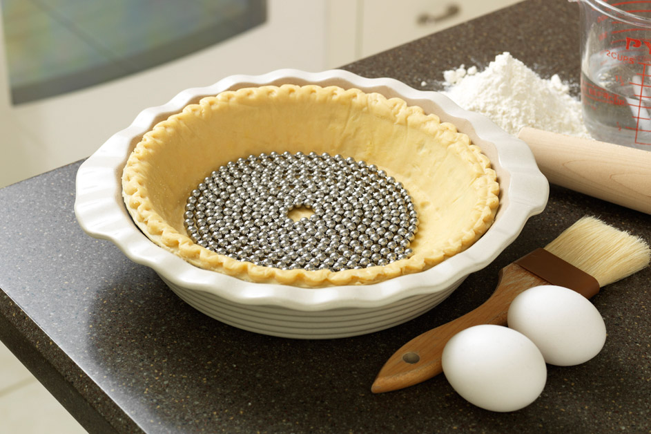 Pie Weight Chain sitting on formed pie dough in a pie pan