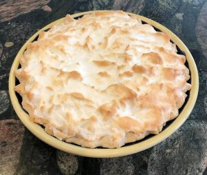 lemon meringue pie freshly baked and out of the oven.